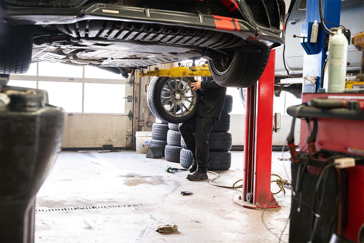 Certified technician servicing a vehicle